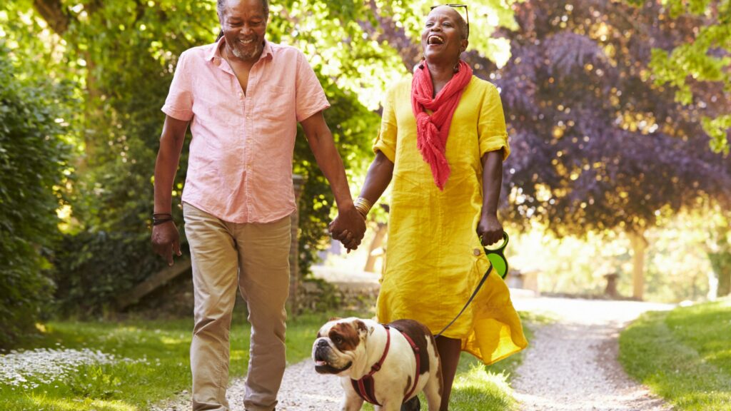 Older couple walking the dog